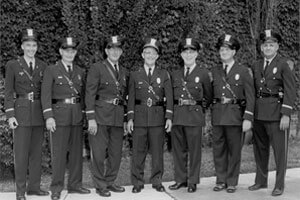 A vintage photograph of 7 ISU officers.
