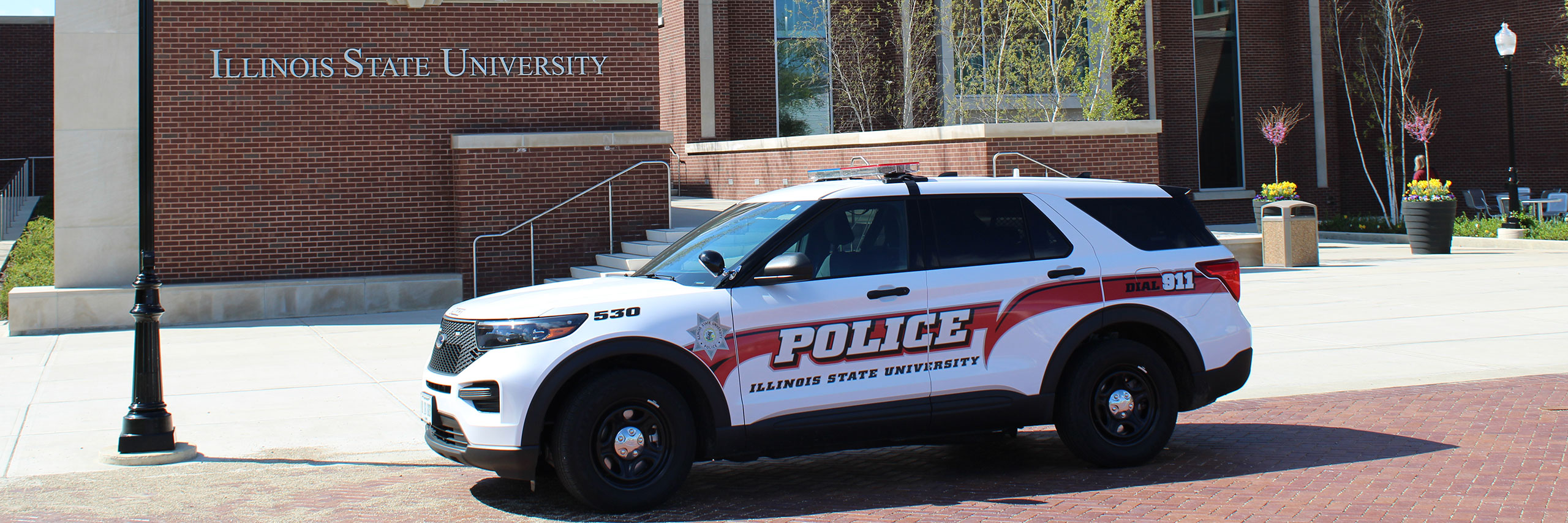 An ISU Police car in front of the Bone Student Center building.